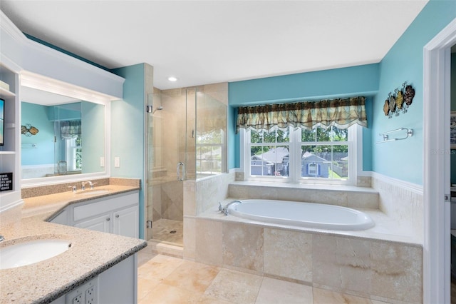 716 Timberwilde Ave, Winter Springs, FL 32708 - full bathroom featuring vanity, a shower stall, a garden tub, tile patterned floors, and recessed lighting