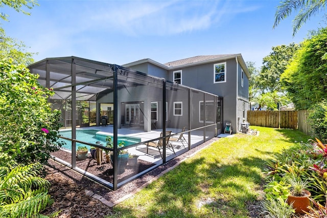 716 Timberwilde Ave, Winter Springs, FL 32708 - rear view of house featuring a fenced backyard, a patio area, stucco siding, and glass enclosure