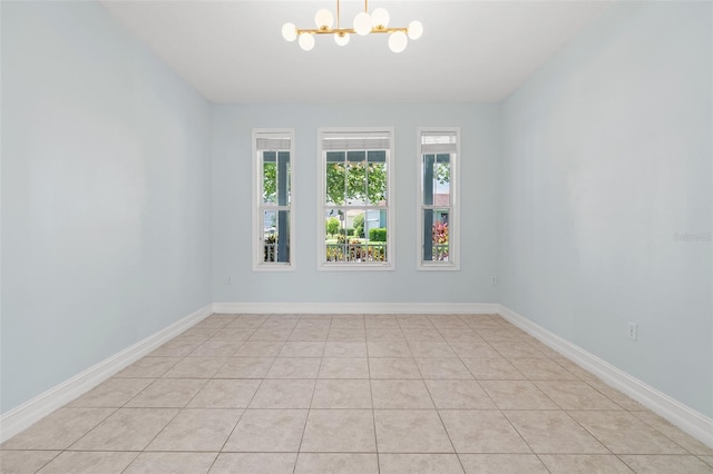 6905 Beargrass Rd, Harmony, FL 34773 - unfurnished room with a chandelier and light tile patterned floors