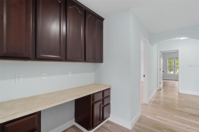 6905 Beargrass Rd, Harmony, FL 34773 - hall with arched walkways and light wood finished floors