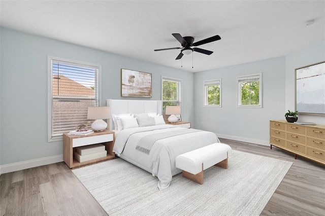 6905 Beargrass Rd, Harmony, FL 34773 - bedroom with wood finished floors and a ceiling fan
