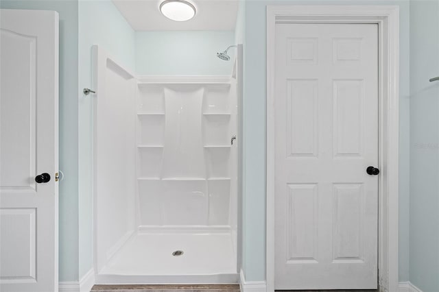 6905 Beargrass Rd, Harmony, FL 34773 - full bathroom featuring a shower stall and baseboards