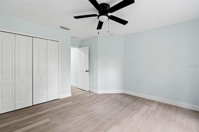6905 Beargrass Rd, Harmony, FL 34773 - unfurnished bedroom with light wood-type flooring, a closet, and ceiling fan