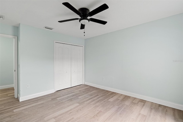6905 Beargrass Rd, Harmony, FL 34773 - unfurnished bedroom featuring light wood finished floors, a closet, and ceiling fan