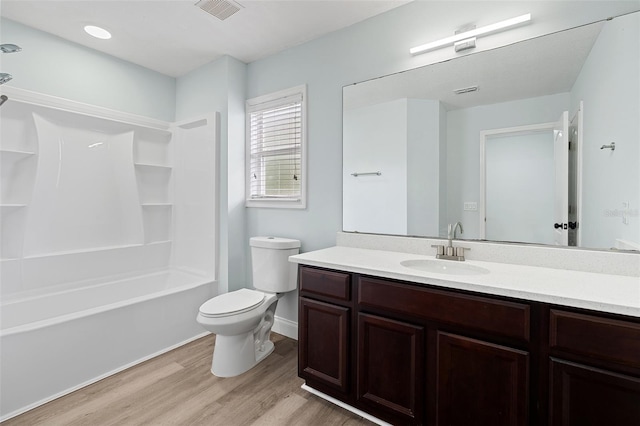6905 Beargrass Rd, Harmony, FL 34773 - bathroom featuring wood finished floors, vanity, and shower / bath combination