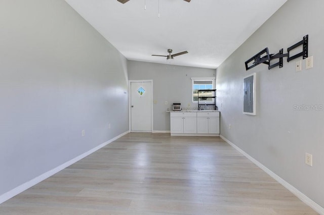 4361 Albritton Rd, Saint Cloud, FL 34772 - empty room with a ceiling fan, electric panel, light wood finished floors, and lofted ceiling
