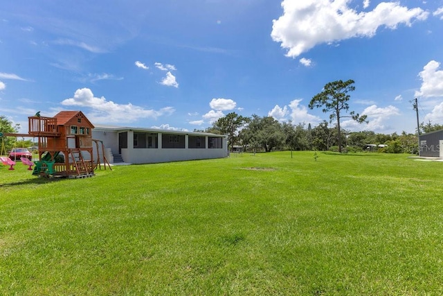 4361 Albritton Rd, Saint Cloud, FL 34772 - view of green lawn featuring a playground and a sunroom