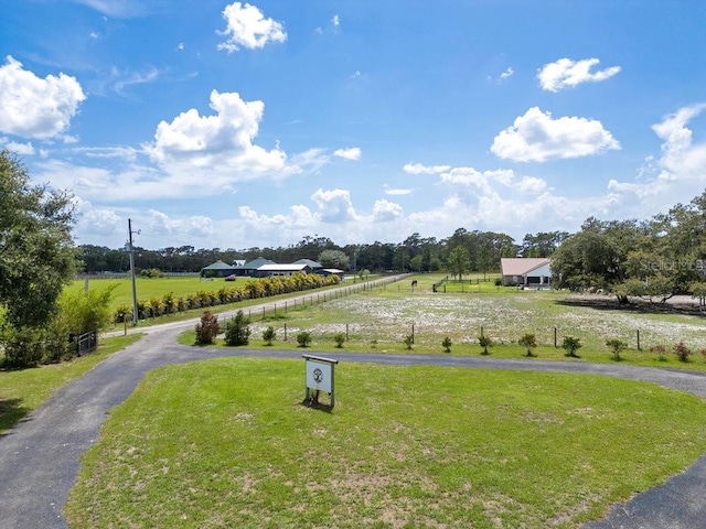 4361 Albritton Rd, Saint Cloud, FL 34772 - view of grassy yard with a view of countryside and curved driveway