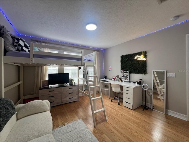 3339 Primrose Willow Dr, Saint Cloud, FL 34773 - office area with light wood-style floors and a textured ceiling