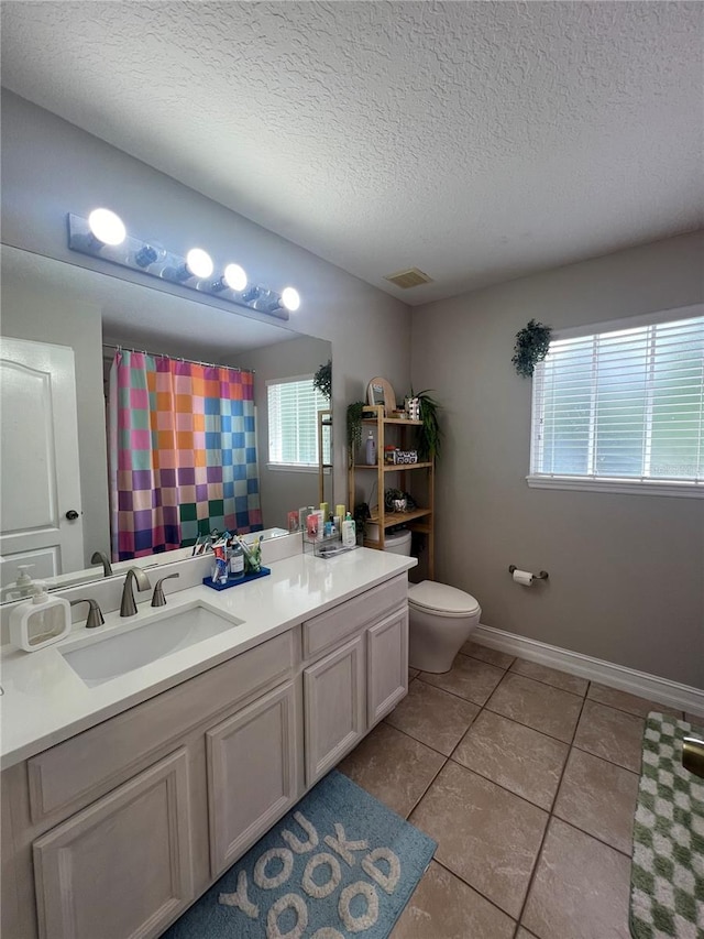 3339 Primrose Willow Dr, Saint Cloud, FL 34773 - full bathroom with a textured ceiling, vanity, tile patterned flooring, and a shower with curtain