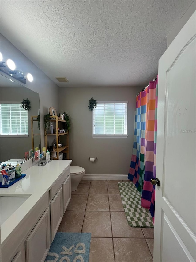 3339 Primrose Willow Dr, Saint Cloud, FL 34773 - bathroom featuring vanity, a textured ceiling, tile patterned floors, and a shower with curtain