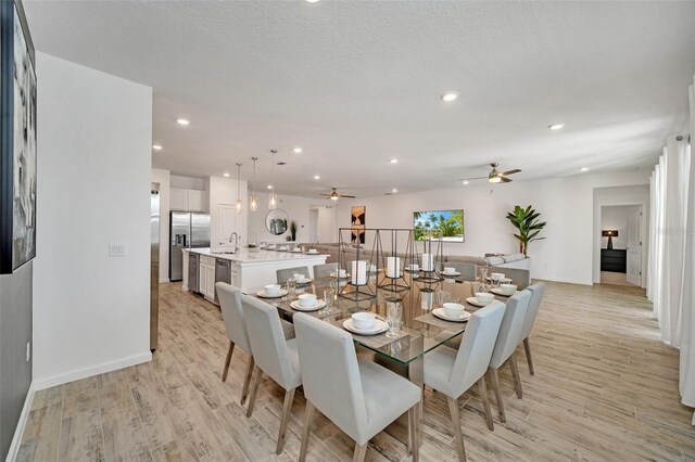 2525 Shanti Dr, Kissimmee, FL 34746 - dining space with a ceiling fan, light wood-style flooring, and recessed lighting