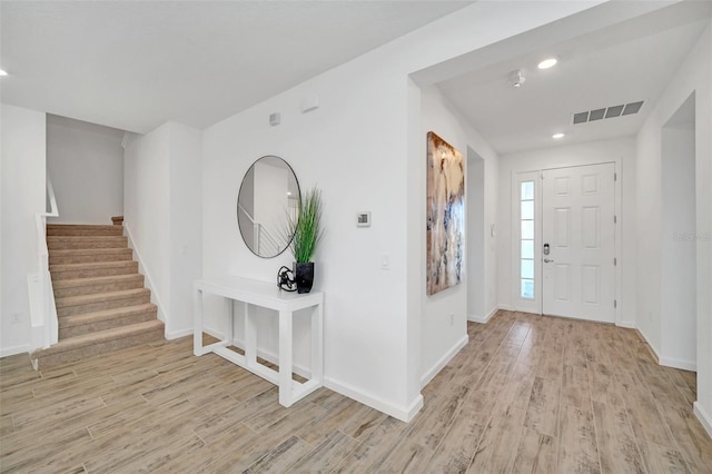2525 Shanti Dr, Kissimmee, FL 34746 - entrance foyer with light wood-style flooring, stairway, and recessed lighting
