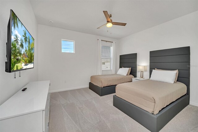 2525 Shanti Dr, Kissimmee, FL 34746 - bedroom featuring light colored carpet and ceiling fan
