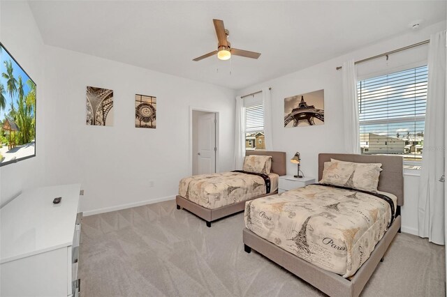 2525 Shanti Dr, Kissimmee, FL 34746 - bedroom featuring light carpet and a ceiling fan