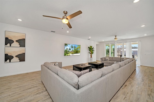 2525 Shanti Dr, Kissimmee, FL 34746 - living area with a ceiling fan, recessed lighting, and light wood-type flooring