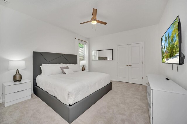 2525 Shanti Dr, Kissimmee, FL 34746 - bedroom with light carpet, a closet, and a ceiling fan