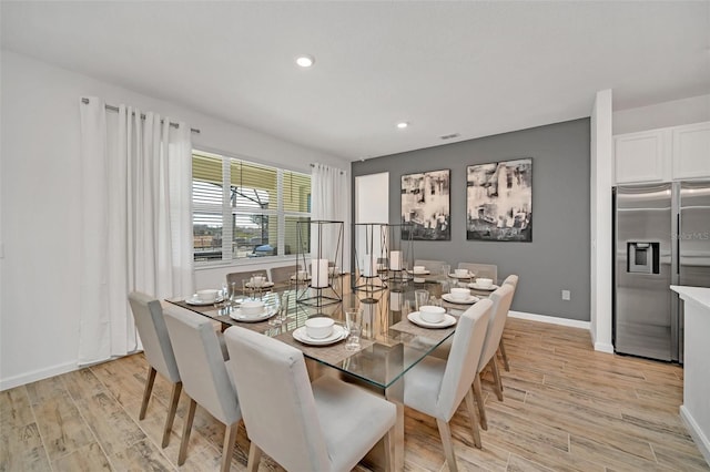 2525 Shanti Dr, Kissimmee, FL 34746 - dining area featuring light wood-type flooring and recessed lighting