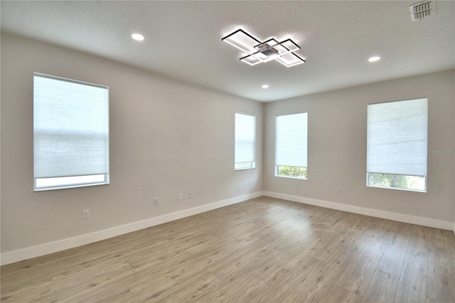 2673 Calistoga Ave, Kissimmee, FL 34741 - empty room featuring light wood-type flooring and recessed lighting