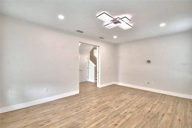 2673 Calistoga Ave, Kissimmee, FL 34741 - unfurnished room with wood finished floors and recessed lighting