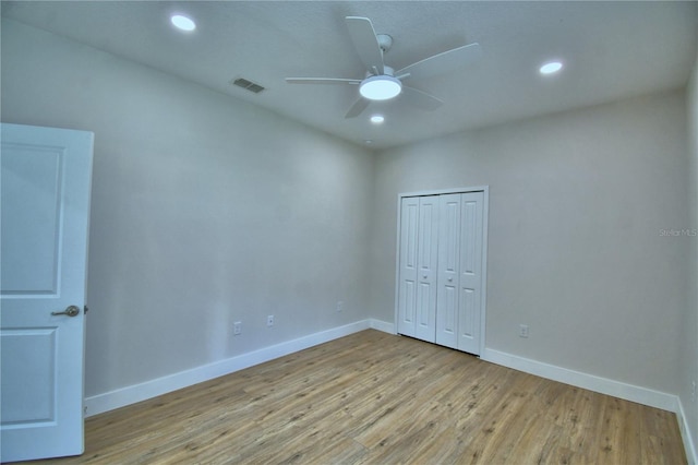 2673 Calistoga Ave, Kissimmee, FL 34741 - unfurnished bedroom with wood finished floors, a closet, recessed lighting, and ceiling fan