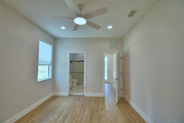 2673 Calistoga Ave, Kissimmee, FL 34741 - unfurnished bedroom featuring light wood finished floors, recessed lighting, connected bathroom, and ceiling fan