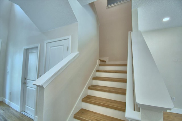 2673 Calistoga Ave, Kissimmee, FL 34741 - stairway with wood finished floors and recessed lighting