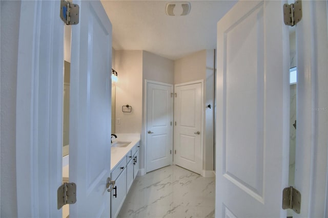 2673 Calistoga Ave, Kissimmee, FL 34741 - bathroom featuring marble look tiles and vanity