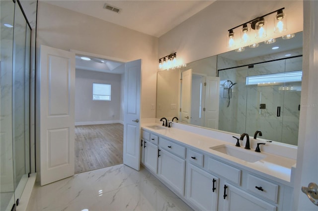 2673 Calistoga Ave, Kissimmee, FL 34741 - full bath featuring a marble finish shower, double vanity, and marble look tiles