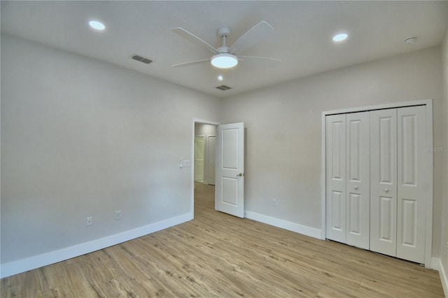 2673 Calistoga Ave, Kissimmee, FL 34741 - unfurnished bedroom featuring light wood-style floors, recessed lighting, a ceiling fan, and a closet