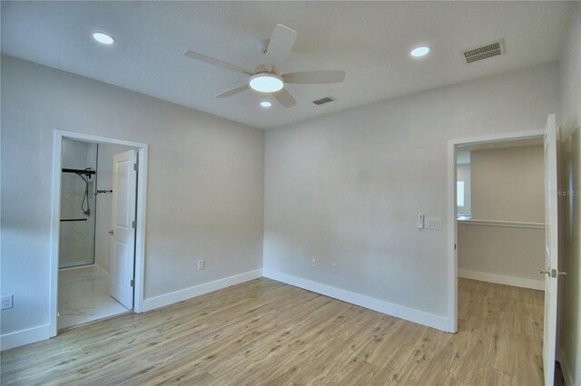 2673 Calistoga Ave, Kissimmee, FL 34741 - unfurnished bedroom with light wood finished floors, recessed lighting, ensuite bath, and ceiling fan