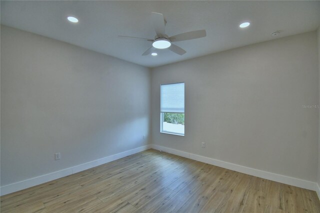 2673 Calistoga Ave, Kissimmee, FL 34741 - spare room with wood finished floors, ceiling fan, recessed lighting, and a smoke detector