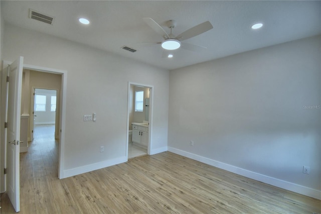 2673 Calistoga Ave, Kissimmee, FL 34741 - unfurnished bedroom featuring light wood-style flooring, recessed lighting, connected bathroom, and a ceiling fan