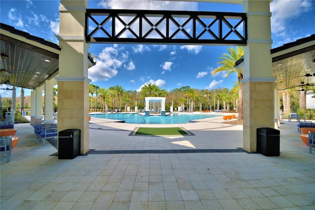 2673 Calistoga Ave, Kissimmee, FL 34741 - community pool featuring a patio area and a ceiling fan