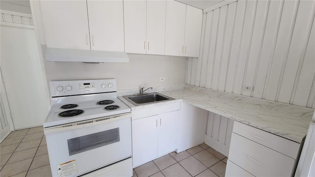 10301 US Highway 27 Unit 94B, Clermont, FL 34711 - kitchen featuring white electric stove, under cabinet range hood, light tile patterned floors, white cabinetry, and light stone counters