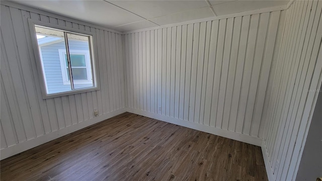 10301 US Highway 27 Unit 94B, Clermont, FL 34711 - spare room with dark wood finished floors and wooden walls