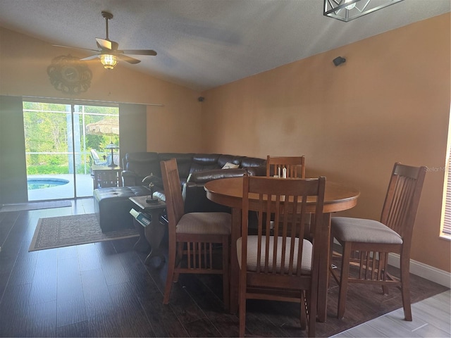 204 Canary Island Cir, Davenport, FL 33837 - dining room with lofted ceiling, a ceiling fan, and wood finished floors