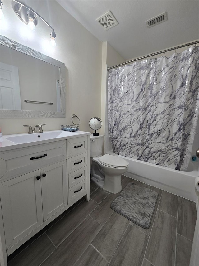 204 Canary Island Cir, Davenport, FL 33837 - bathroom featuring vanity, shower / bath combo, and wood finish floors