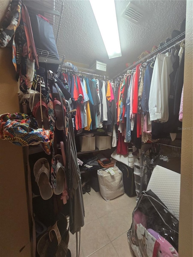 204 Canary Island Cir, Davenport, FL 33837 - walk in closet featuring tile patterned floors
