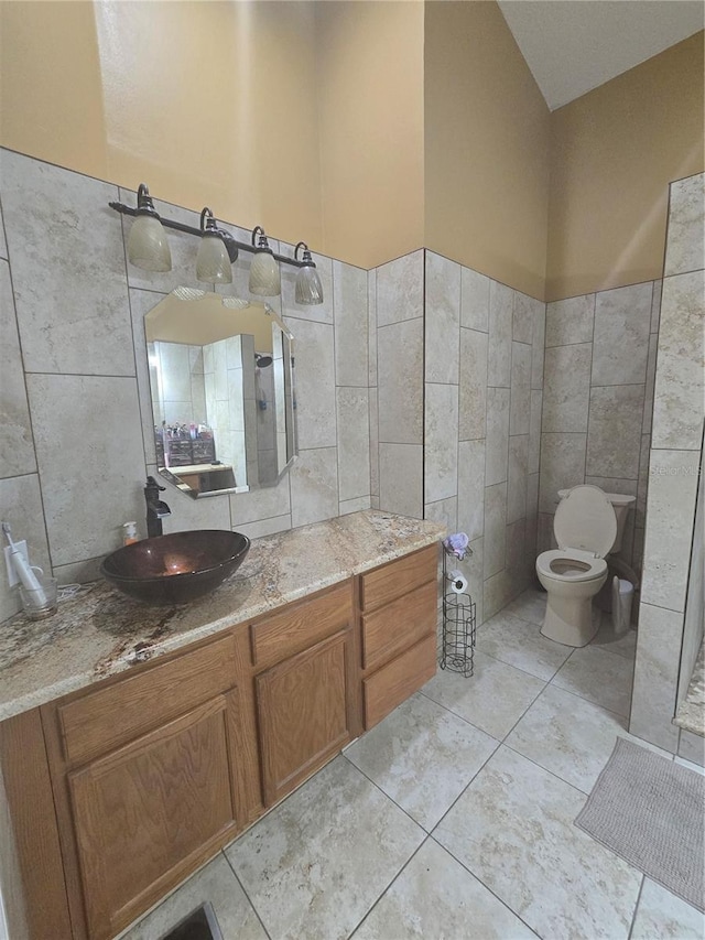 204 Canary Island Cir, Davenport, FL 33837 - bathroom with tile walls, vanity, and tile patterned floors