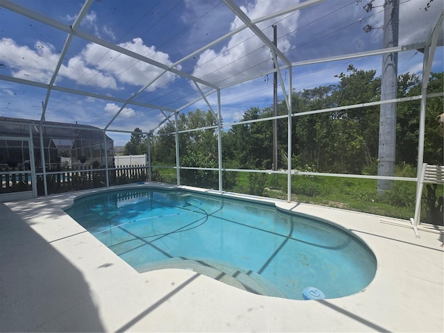 204 Canary Island Cir, Davenport, FL 33837 - outdoor pool featuring glass enclosure and a patio