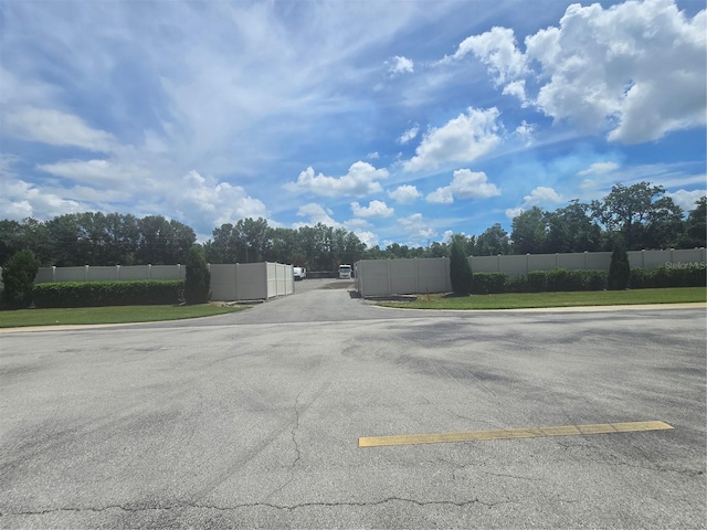 204 Canary Island Cir, Davenport, FL 33837 - view of asphalt road featuring a gate