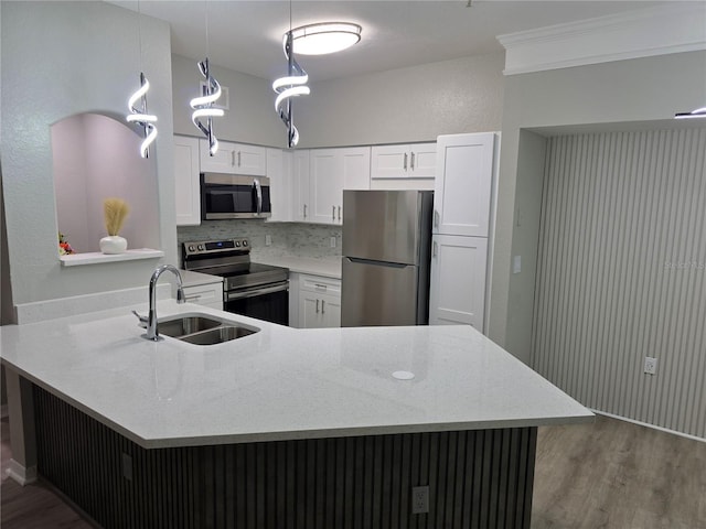 3428 Soho St Unit 208, Orlando, FL 32835 - kitchen with appliances with stainless steel finishes, wood finished floors, white cabinetry, and light stone counters