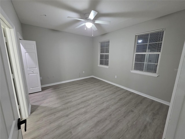 3428 Soho St Unit 208, Orlando, FL 32835 - unfurnished bedroom with wood finished floors and ceiling fan