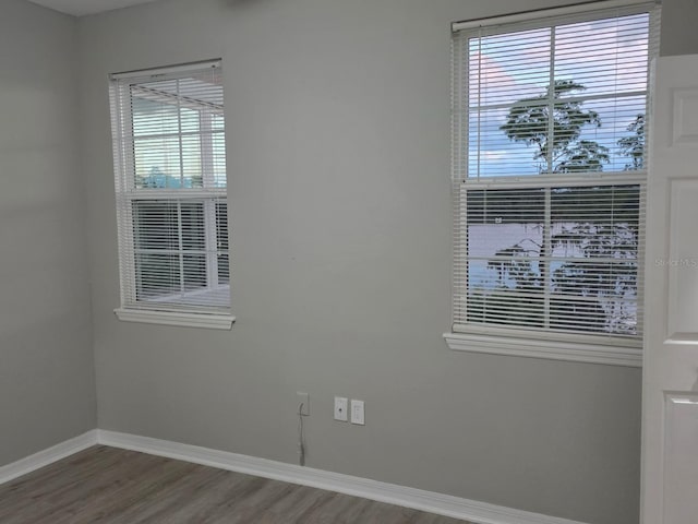 3428 Soho St Unit 208, Orlando, FL 32835 - empty room with baseboards and wood finished floors