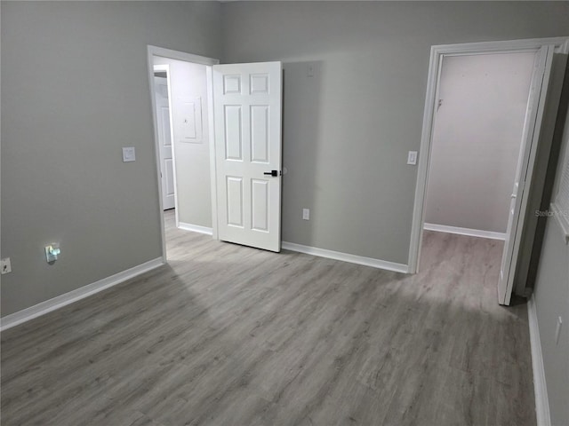 3428 Soho St Unit 208, Orlando, FL 32835 - unfurnished bedroom with a walk in closet, wood finished floors, and a closet
