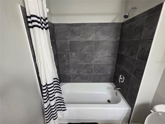 3428 Soho St Unit 208, Orlando, FL 32835 - full bathroom featuring shower / tub combo with curtain and toilet