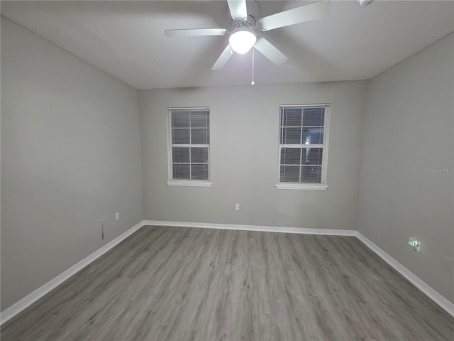 3428 Soho St Unit 208, Orlando, FL 32835 - spare room featuring wood finished floors and a ceiling fan