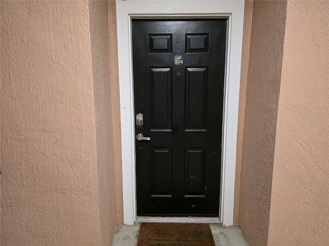 3428 Soho St Unit 208, Orlando, FL 32835 - property entrance with stucco siding