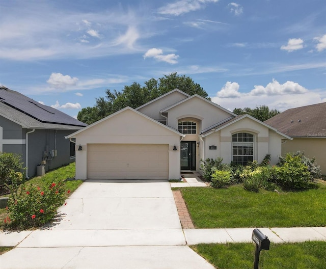 2807 Playing Otter Ct, Kissimmee, FL 34747 - single story home with a garage, driveway, stucco siding, and a front lawn